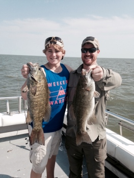 A couple with a couple of bass they caught