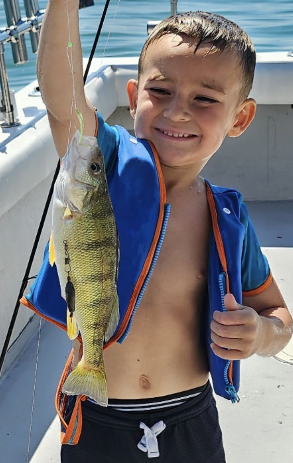 Young boy with huge perch