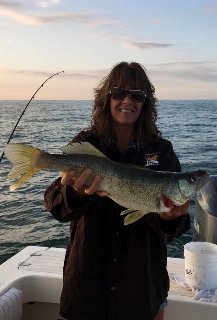 Young lady holding a large walleye