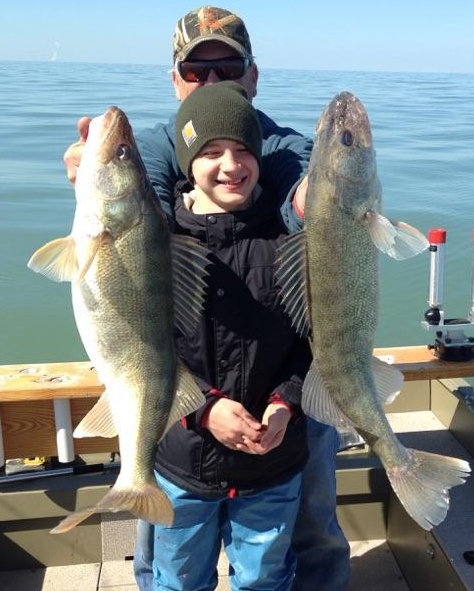 Youngster holding his first walleye