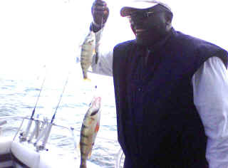 Youngster holding his first walleye